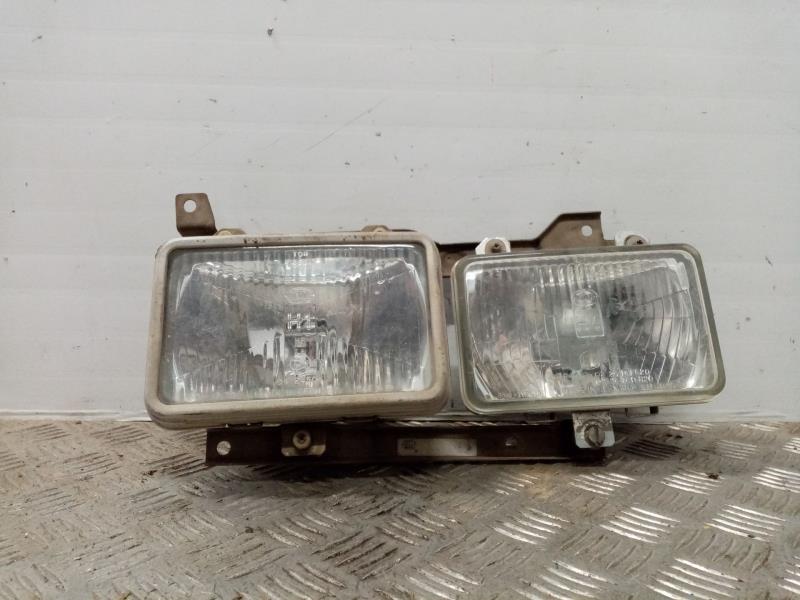 Gruppo ottico anteriore principale sinistro (luci)(faro) NISSAN VANETTE (C 220) Vanette Transporter Gasolina - 1